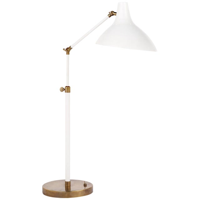 Charlton Table Lamp in White and Hand-Rubbed Antique Brass Designer: AERIN Height: 17" - 27" Base: 8" Round Socket: E26...