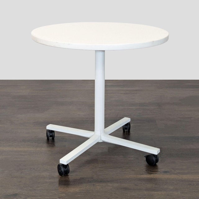 Laminate top on metal base with castors, designed by Dan Grabowski. Brand: Herman Miller. Dimensions (in): 30W x 30D x 29H.