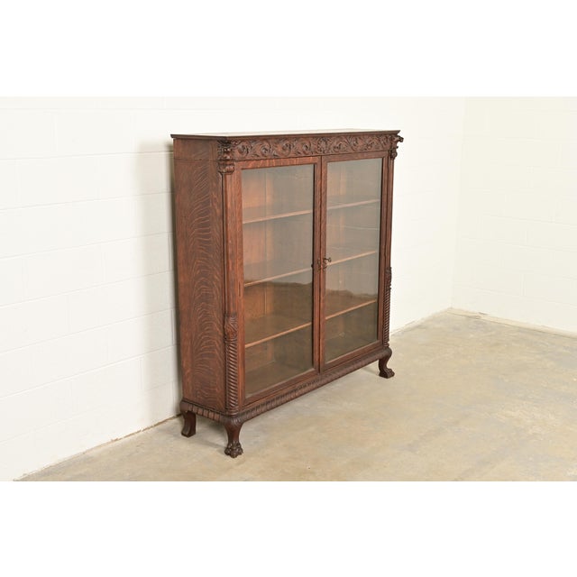 R. J. Horner & Co. R. J. Horner Style Victorian Oak Double Bookcase With Carved Lion Heads and Paw Feet, Circa 1890s For Sale - Image 4 of 13