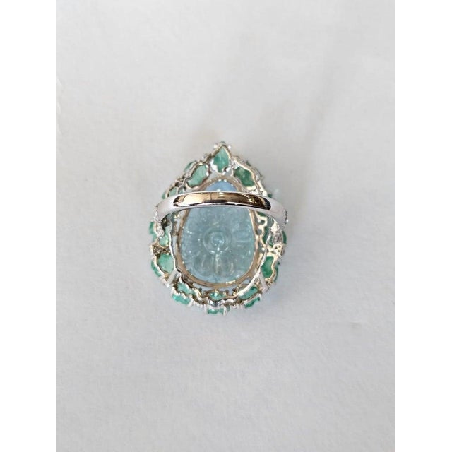 A very gorgeous and beautiful, one of a kind, Aquamarine & Emeralds Cocktail Ring set in 18K White Gold & natural...