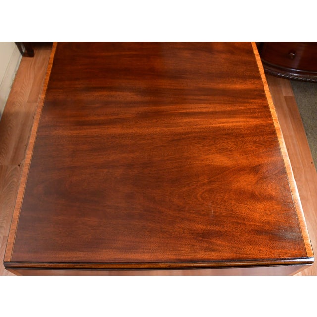 We are pleased to offer this beautiful Antique English Regency Drop-leaf sofa table, from the 1920s. This Table is made of...