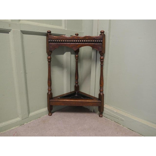 A Turned Oak Corner Stick and Umbrella Stand This is a very unusual piece, it is made from turned oak and it fits very...