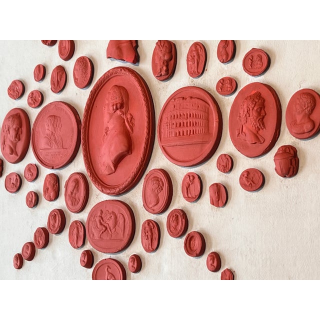 Set 1013: A beautiful Grand Tour revival, Neoclassical style red painted and waxed plaster intaglio cast collection. The...