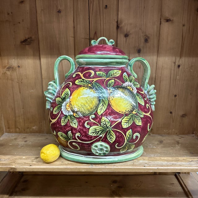 Giant Italian vessel. In beautiful condition. lion head handles. Lemon tree motifs. 17 “ tall 17 “ wide 13” foots