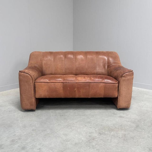 Remarks: Vintage De Sede two seat sofa, model DS 44. Brown, thick neck leather upholstery. Very comfortable and solid....