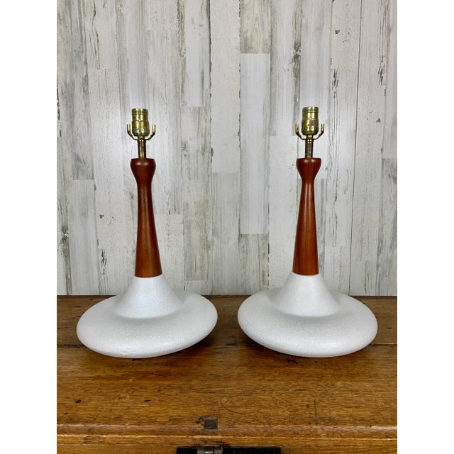 Sculptural pottery base with walnut stem base dimensions 12 L x 12 D x 21 H.