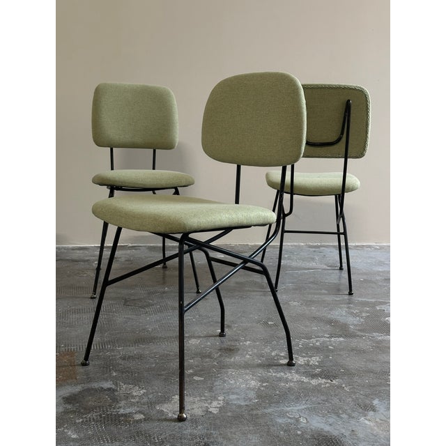Set of 4 "Cocorita" chairs, made by Velca Legnano, designed by Gastone Rinaldi in the 1950s. Black lacquered metal frame,...