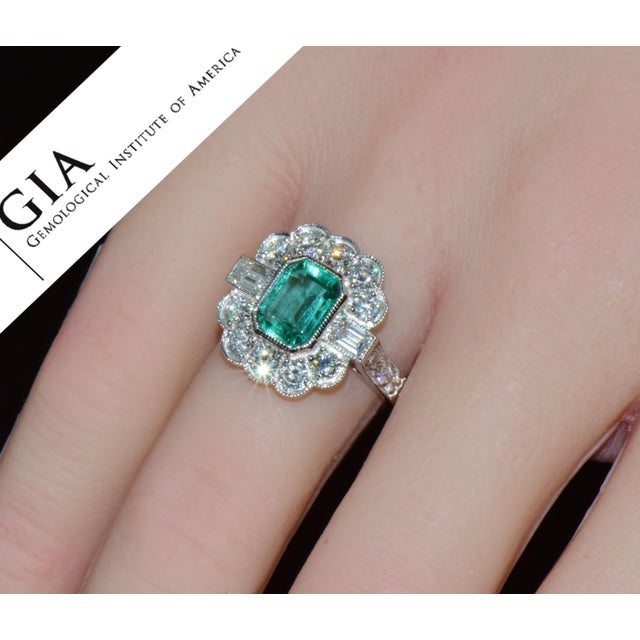GIA certified 2.53CTS diamond and emerald solid 18K white gold ring. This elegant cocktail / engagement ring features a...