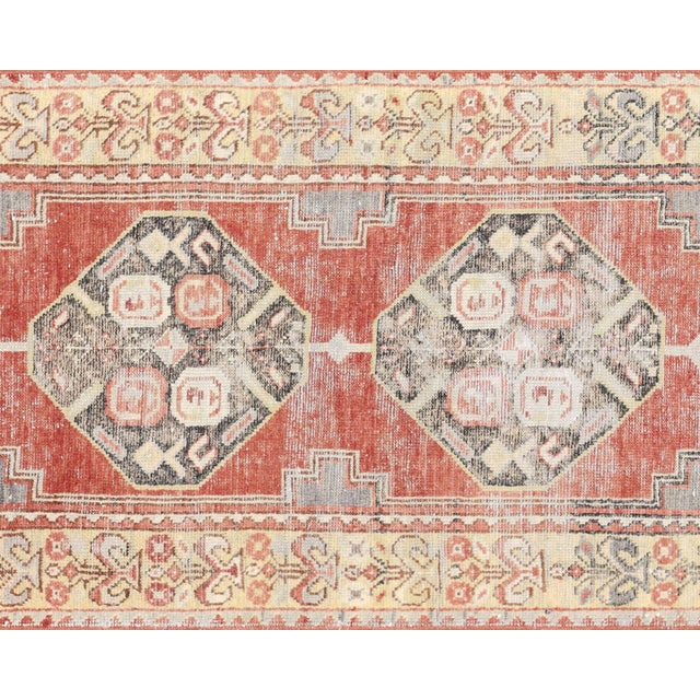 Handwoven vintage Turkish Oushak runner measuring 2'11" x 9'8". Crafted with wool on wool foundation in Western Turkey's...