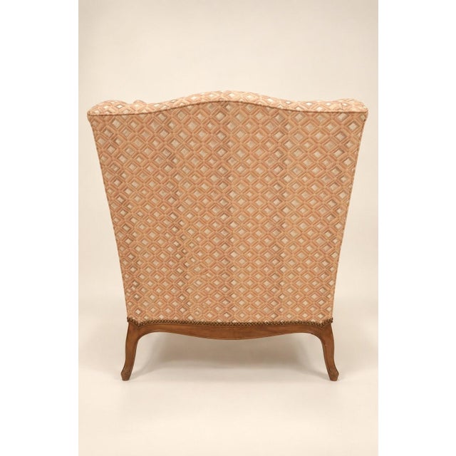 Large louis xv style bergère armchair, known as a "fireside chair," with wide, enveloping sides forming wingbacks and...
