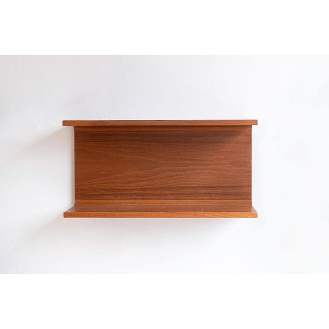 Set of two danish wall shelves in teak by the pedersen & hansen, 1960s. The wall shelves are in very good condition and...