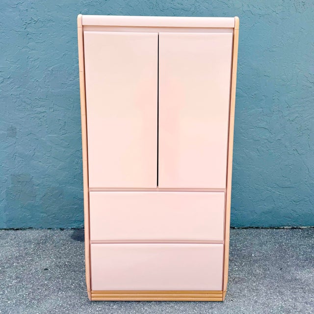 A striking postmodern armoire that perfectly captures the playful sophistication of late 20th-century design. Finished in...