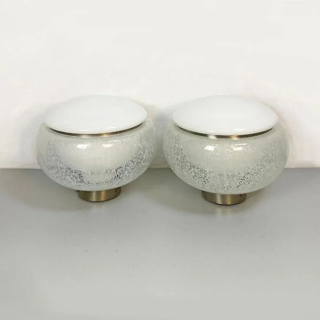 Italian Mid-Century Modern pair of Murano glass and steel table lamps, 1960s Pair of Murano glass lamps with opaline glass...