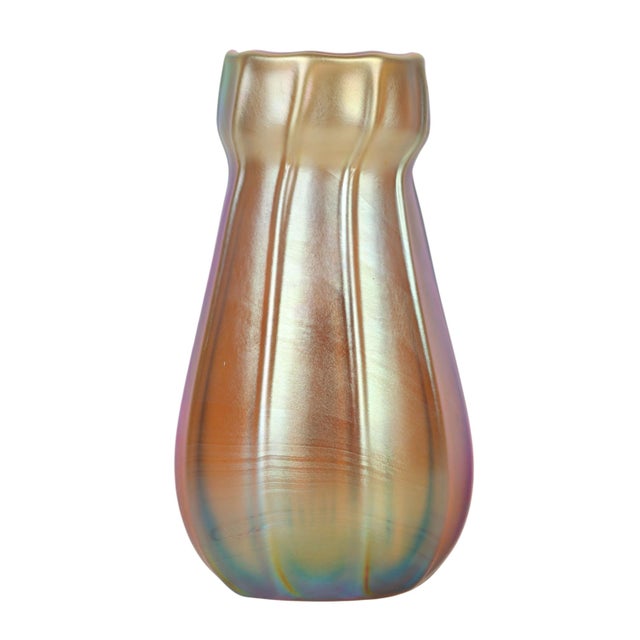 An exquisite early 20th-century Tiffany Studios Favrile glass bud vase, created by Tiffany Studios circa 1920 and...