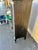 Antique Dark wood cabinet. The shelves can be adjusted. Easily moves around the room on Wooden Wheels. Removable white...