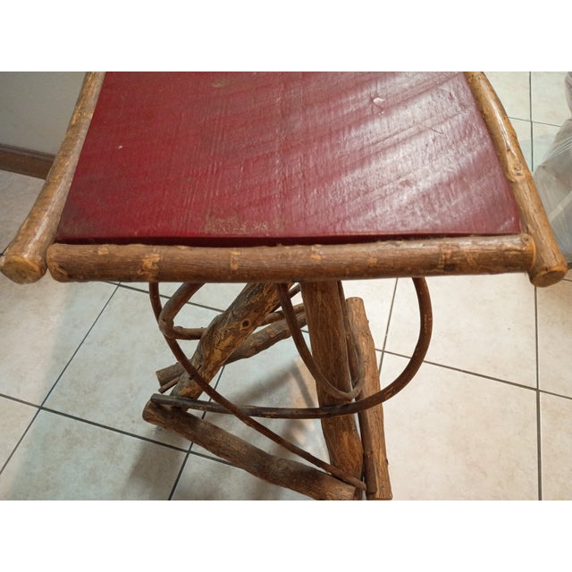 Adirondack side table is made from bent willow branches with original paint and nails. I found it in an abandoned barn at...