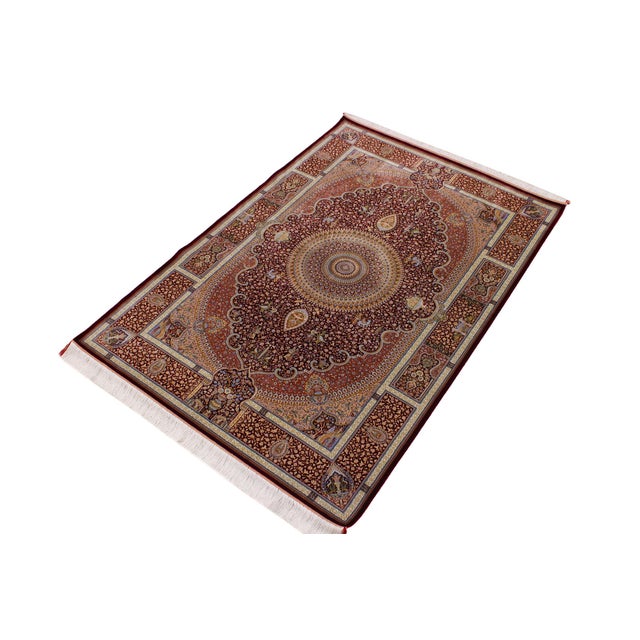 Transform your space with this stunning hand-knotted silk rug, meticulously crafted by skilled artisans using traditional...
