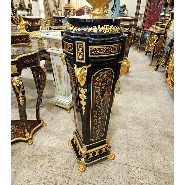 Make a bold statement with this luxurious oversized wood pedestal, exquisitely crafted with intricate gold leaf detailing,...