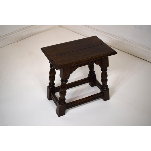 Late 19th-Century/Early 20th-Century English Joined Stool-made of solid oak with pegged construction, shaped skirt and...