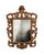 I BLURRED OUT THE IMAGE OF ME TAKING THE PHOTO IN THE MIRROR. A striking and highly decorative carved giltwood wall mirror...
