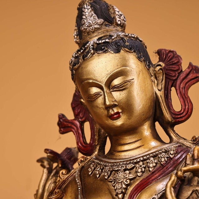 A breathtaking and substantial vintage sculpture of Green Tara (Sgrol-ma), a revered deity in Tibetan Buddhism known for...