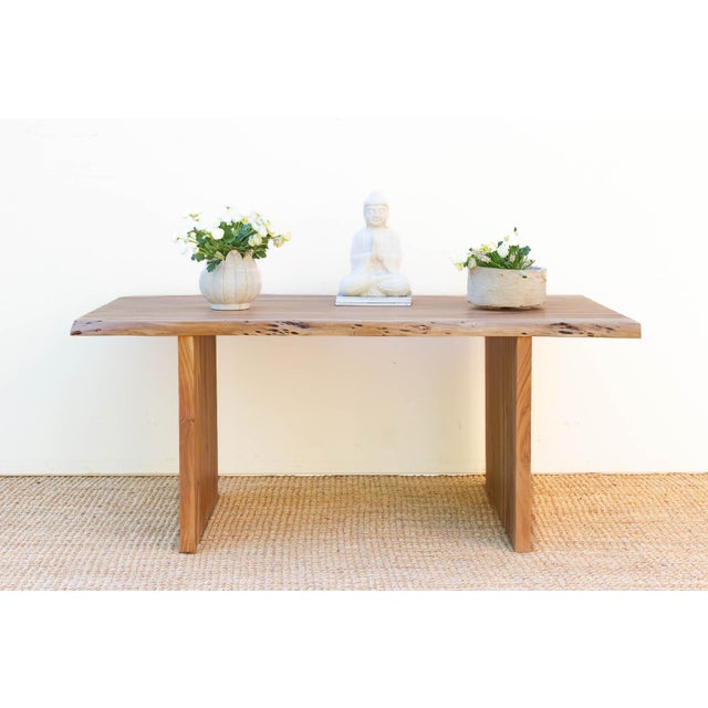 The Monolith Natural Table is an anchor of organic modernism, designed to bring the grounding energy of the outdoors into...