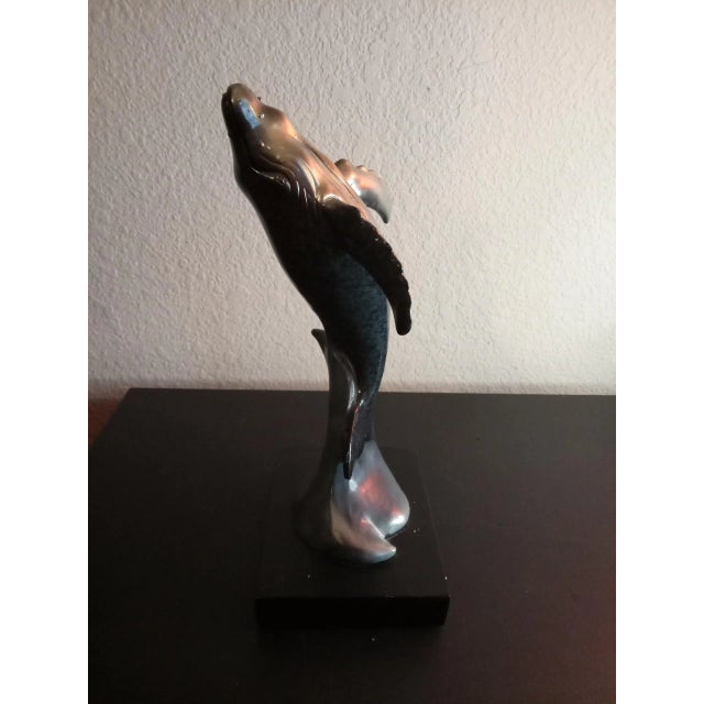 This is a Solid Resin 10" Dolphin on wave Figurine Statue on Pedestal. Procured at an auction
