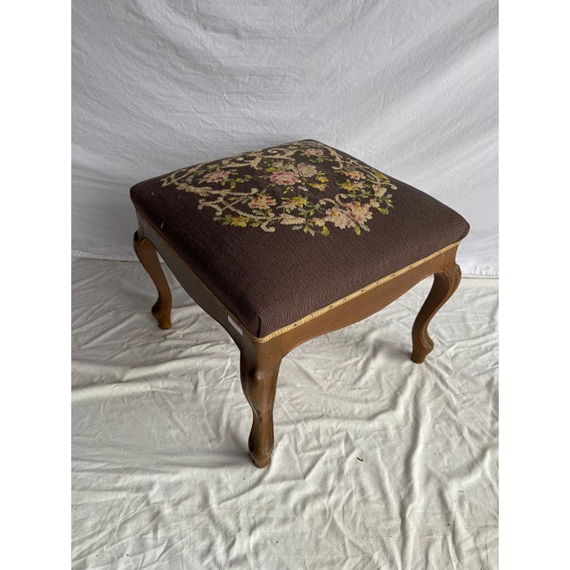 Early 20th Century Floral Victorian Needlepoint Parlor Stool. Featuring beautiful flower designs upon the top creating an...