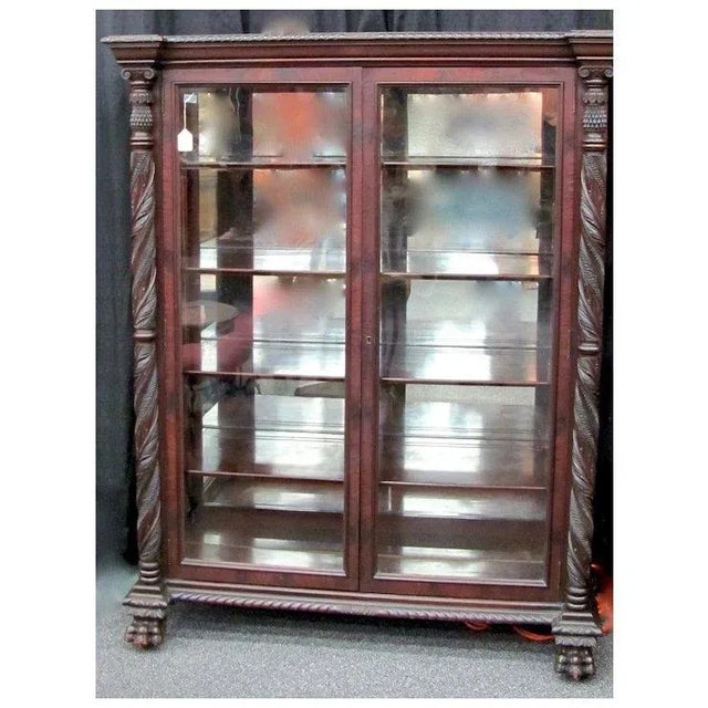 Mahogany China Cabinet with claw feet and carved pillars in fantastic condition. 51"W by 24"D by 64"T