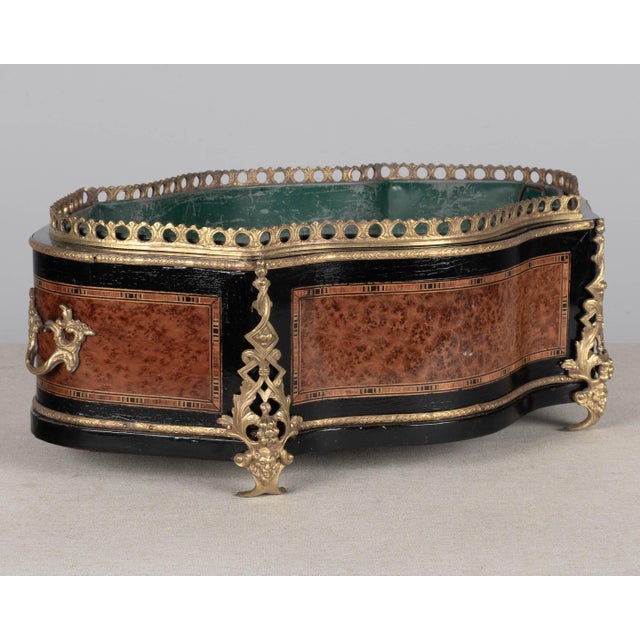 A 19th century French Napoleon III marquetry jardinière, or cache pot, made of mahogany with burl of elm veneer, various...