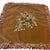 A charming vintage cushion cover featuring an embroidered floral bouquet on a soft light brown velvet ground. The bouquet...