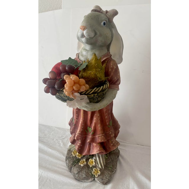 Vintage Whimsical Folk Art Country and Fun Bunny Rabbit Statue Features a lovable bunny rabbit holding a basket standing...