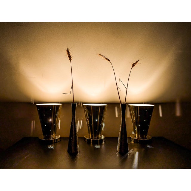 These beautiful Lightolier brass-plated ceiling lights designed by Gerald Thurston were produced and sold in the 1950s....