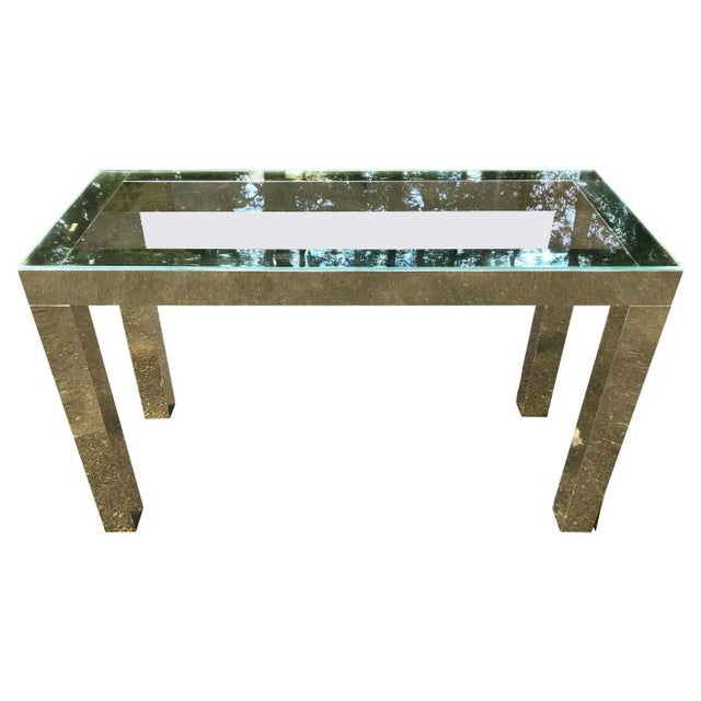 Mid-Century Modern brass and glass console. Laminated brass design with glass top. Very Mod ! Dimensions: Height: 29 in....