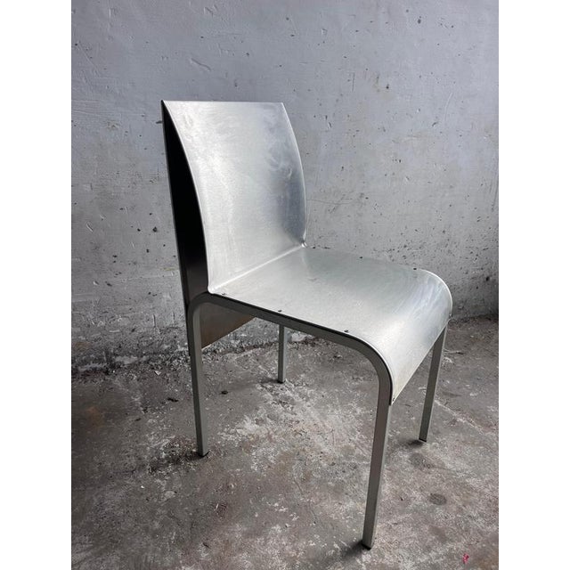 A set of six belgian postmodernist dining chairs from the 1980s, combining sculptural shapes with an industrial aluminium...