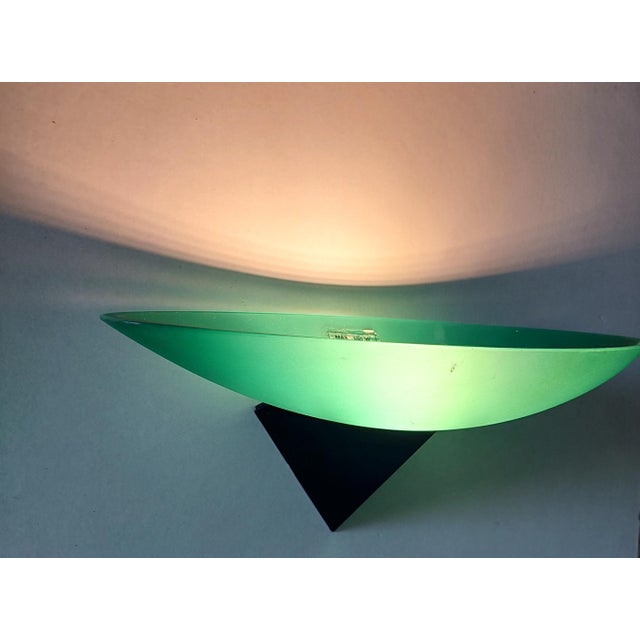 Post modern pair of uplighters wall lights made in frosted turquoise Murano glass and black metal brackets called the...