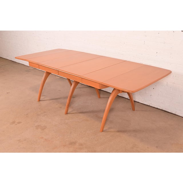 A gorgeous and very versatile Mid-Century Modern solid maple "wishbone" drop-leaf extension dining table By Heywood...