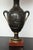 Pair of antique French bronze urn lamps in the neoclassic manner.