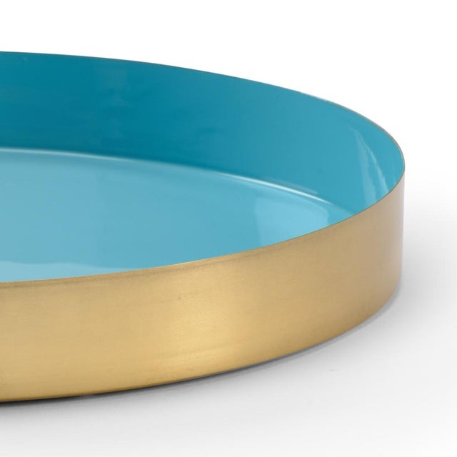 Round tray crafted in aqua enamel with a polished gold exterior. Not for food use. For decoration only. Pairs best with...