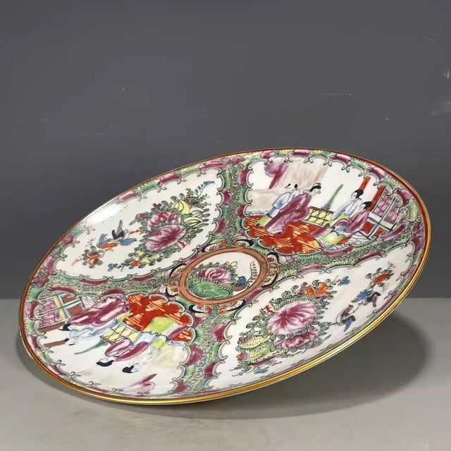 An exquisite 19th-century Chinese porcelain plate, hand-painted, 10 inches in diameter and 1 inch high (excluding the base).