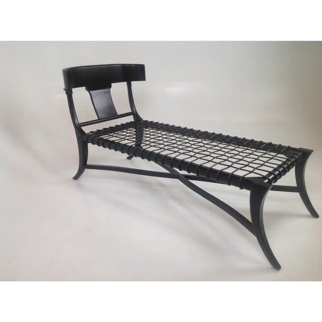 Sophisticated modern chaise lounge in the manner of Robsjohn Gibbings Klismos. The chaise has a dark espresso finish, with...