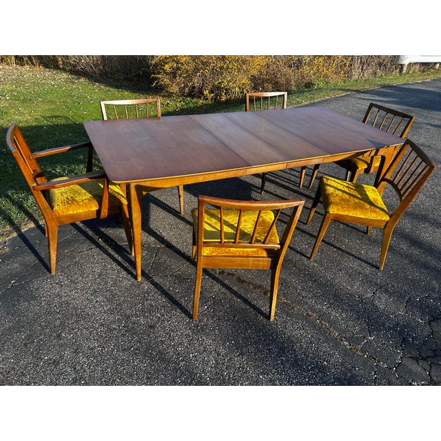 Mid Century wood table and 6 chairs Table has 2 leaves Looks to be in original condition I don’t see a stamp of who makes...