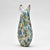 In the tradition of Murano glassmaking, this hand-blown vase is densely encrusted with multicolored millefiori cane slices...