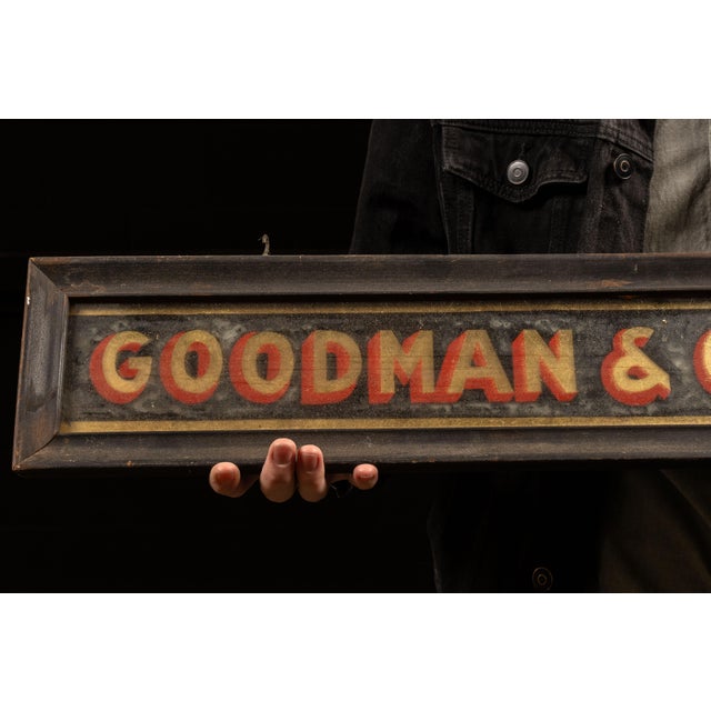 Antique reverse-painted glass mercantile sign for Goodman & Crutchfield, an undertaker firm operating in Cooper County,...