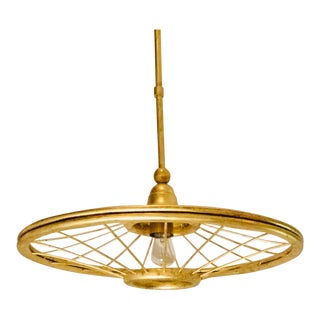 Currey & Co. Modern Gold Finished Wheel Pendant Light For Sale