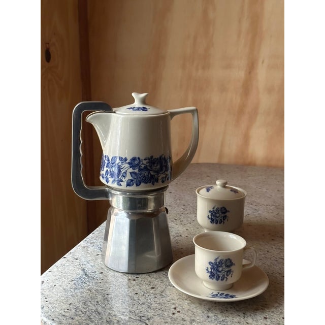 This exquisite Krone Porzellan espresso service captures the quiet poetry of European mornings: porcelain warmed by steam,...