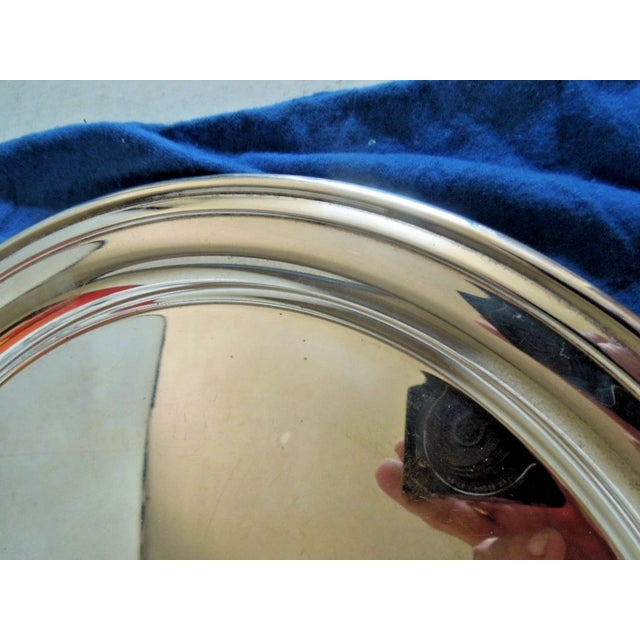 Offered is a beautiful & uncommon Regency style 12" round silverplate serving tray made by Tiffany. It in very good...