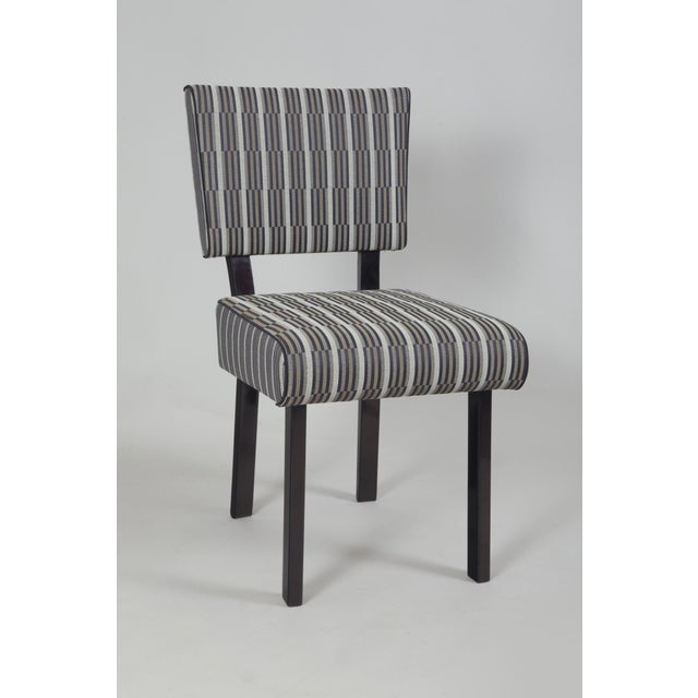 Functionalism dining set of six pieces of chairs in black polish, newly upholstered to the fabric Backhausen according to...