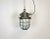 Industrial hanging lamp made in former Czechoslovakia during the 1960s. It features cast iron top, clear glass cover and...