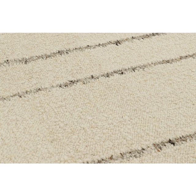 Handwoven in wool, this 9x12 Kilim is a smart contemporary and textural piece from Rug & Kilim, with subtle variations in...